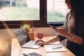 Asian female accountant analyze and discuss the situation on the financial report in meeting room. Financial,accounting,investment