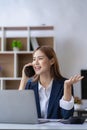 Asian female accountant talking on the phone She is a salesperson at a startup company. Royalty Free Stock Photo