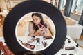 Beauty Enhancement. Asian female blogger applying makeup while recording a tutorial video for her beauty blog using Royalty Free Stock Photo