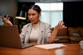 Asian female boss feels dissatisfied, disappointed, and angry with her employee`s work Royalty Free Stock Photo