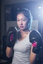 Asian female boxer practicing boxing