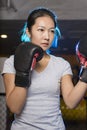 Asian female boxer practicing boxing