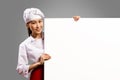 Asian female chef holding poster for the text