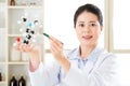 Asian female chemist teacher point at molecular model explain Sc Royalty Free Stock Photo