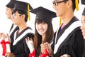 Asian female college graduate at graduation with class Royalty Free Stock Photo