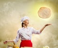 Asian female cook making pizza Royalty Free Stock Photo