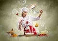 Asian female cooking with magic Royalty Free Stock Photo