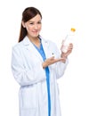 Asian female doctor hold water bottle Royalty Free Stock Photo