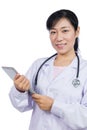 Asian female doctor holding a tablet Royalty Free Stock Photo