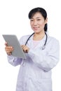 Asian female doctor holding a tablet Royalty Free Stock Photo