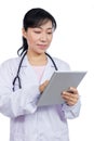 Asian female doctor holding a tablet Royalty Free Stock Photo