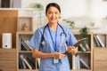 Asian female doctor with a stethoscope smile looking at camera.Nurses wear scrub smile with heartwarming comfortable.Positive