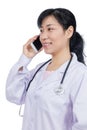 Asian female doctor talking on the phone Royalty Free Stock Photo