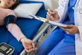 Asian female doctor talks to patient with smile to encourage patient at hospital An elderly