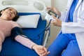 Asian female doctor talks to patient with smile to encourage patient at hospital An elderly