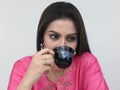 Asian female drinking tea