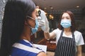 Asian female employee wearing a mask