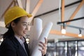 Asian female engineer holding construction blueprint. architect Royalty Free Stock Photo