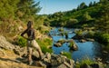 An asian female fly fisher women looking where to fish Royalty Free Stock Photo