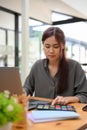 Asian female graphic designer concentrated working on the project Royalty Free Stock Photo