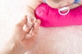 Asian Female hand holding  newborn baby hand. Mom with her child. Maternity, family, birth concept Royalty Free Stock Photo