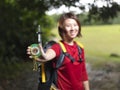 Asian Female Hiker showing her compass Royalty Free Stock Photo