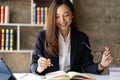 Asian female lawyer working in office or court With hammer and justice scales tablet Royalty Free Stock Photo