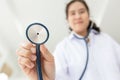 Asian female medical doctor holding stethoscope, young nurse checking patient using stethoscope,standing while looking at camera Royalty Free Stock Photo