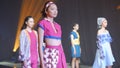 Asian female models wear colorful casual party outfits on the catwalk stage