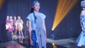 Asian female models wear colorful casual party outfits on the catwalk stage