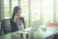 Female operator is talking on the phone to service client in the telemarkerting office Royalty Free Stock Photo