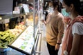 Asian female are ordering,buying food in the food court after Coronavirus quarantine or Covid-19 with plastic shield partition