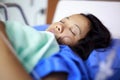 Asian female patient sleeping Royalty Free Stock Photo