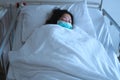 Asian female patient sleeping on hospital bed to recovering sickness, healthcare and medical concept - image Royalty Free Stock Photo