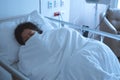 Asian female patient sleeping on hospital bed to recovering sickness, healthcare and medical concept - image Royalty Free Stock Photo