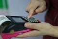 Woman hand with credit card swipe through terminal for sale