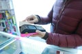 Woman hand with credit card swipe through terminal for sale