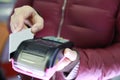 Woman hand with credit card swipe through terminal for sale