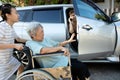 Asian female people enjoy talking on the phone,opening the door car slamming the leg of elderly feel pain,.inattentive girl