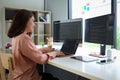 Asian female programmer working at at modern office. Developing programming Royalty Free Stock Photo