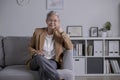 Asian female psychologist sitting on the sofa, working in office. Psychotherapy services, mental health professional concept Royalty Free Stock Photo