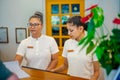 Asian female receptionists during duty hours at the tropical resort