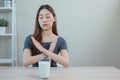 Asian female resistance deny drinking milk, symptom lactose allergy, concept of health problem, stop milk type drink, women