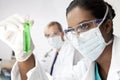 Asian Female Scientist With Green Solution Royalty Free Stock Photo