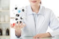 Asian female scientist teacher point at molecular model explain Royalty Free Stock Photo