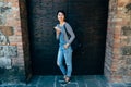 Asian female standing in front of big gate door Royalty Free Stock Photo