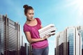 Asian female student carry a lot of books Royalty Free Stock Photo