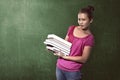 Asian female student carry a lot of books Royalty Free Stock Photo
