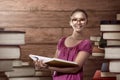 Asian female student carry a lot of books Royalty Free Stock Photo