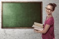 Asian female student carry a lot of books Royalty Free Stock Photo